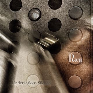 A closeup of a device with a brushed metal finish. Four columns of round buttons are arranged vertically, and they alternate from gray to black. The image is a double exposure, and there are indistinct shapes out of focus and suggesting motion. Near the bottom left corner is the text under zealous silence, and the name Ray is near the right margin.